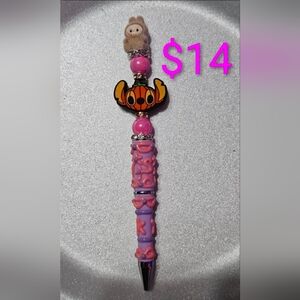 Handmade Purple and Pink Pen With a Pumpkin Focal Stitch